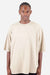 Shaka Wear SHGDD Mens Garment Dyed Drop Shoulder Short Sleeve Crewneck T-Shirt Cream Model Front