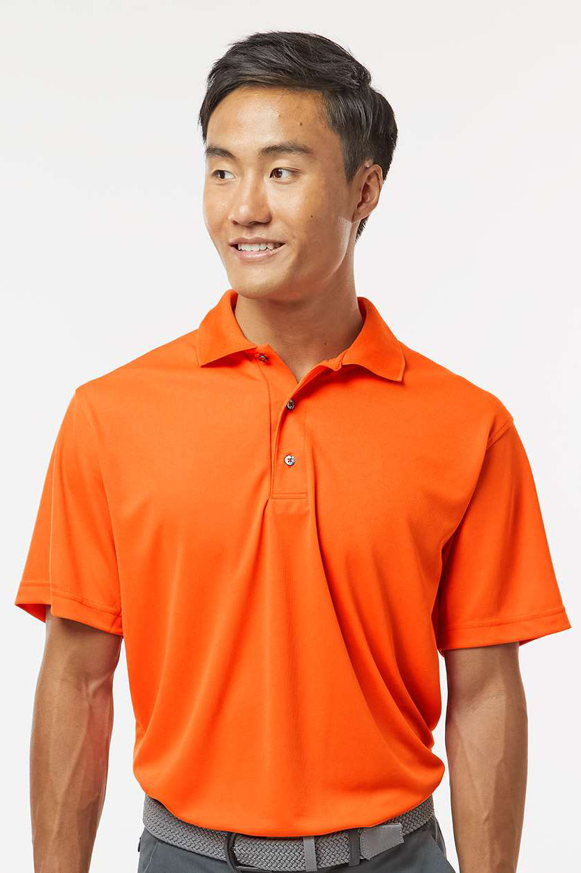Paragon 100 Mens Saratoga Performance Moisture Wicking Mini Mesh Short Sleeve Polo Shirt Orange Model Front