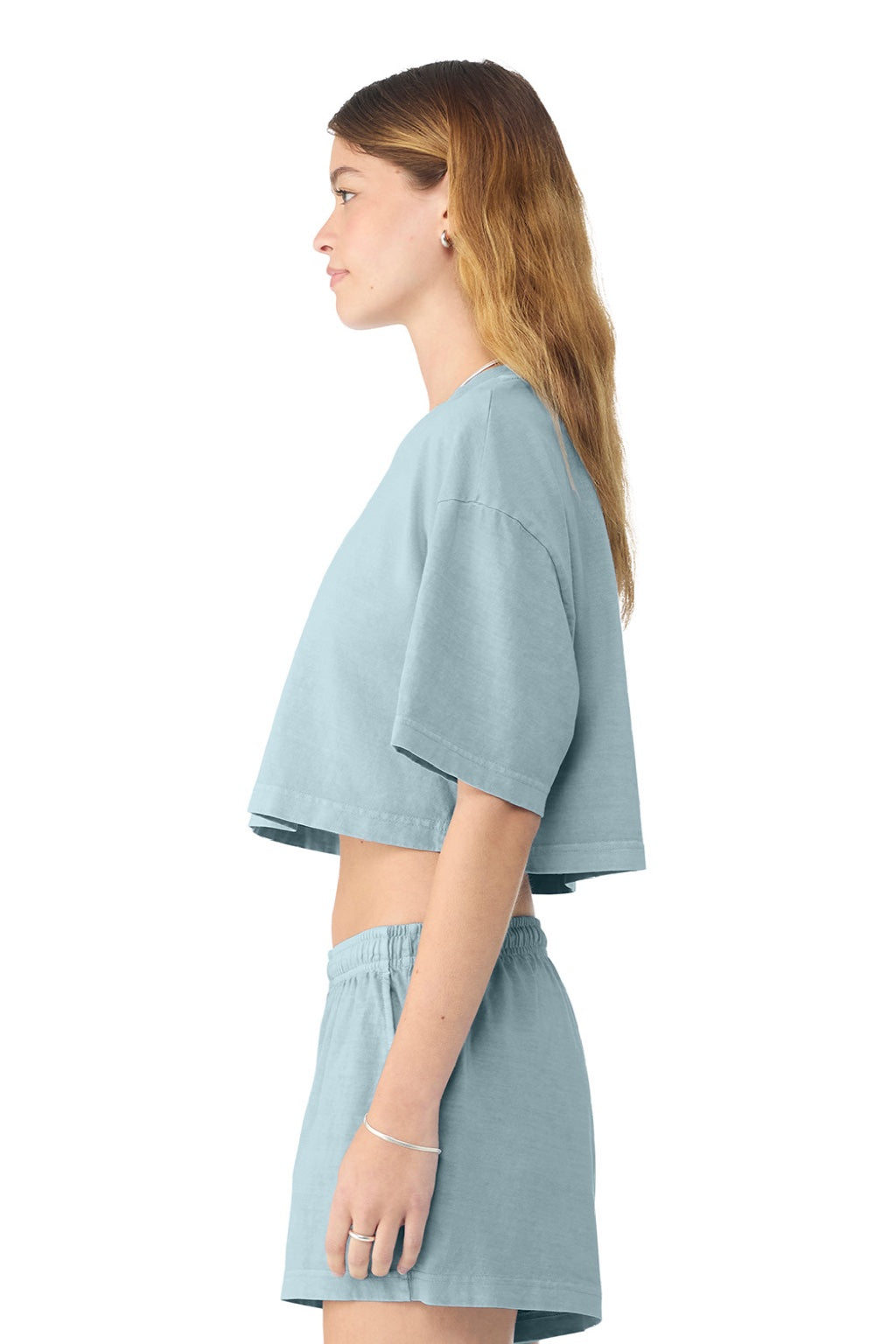 Bella + Canvas BC6882GD Womens Garment Dyed Cropped Short Sleeve Crewneck T-Shirt Light Washed Denim Blue Model Side