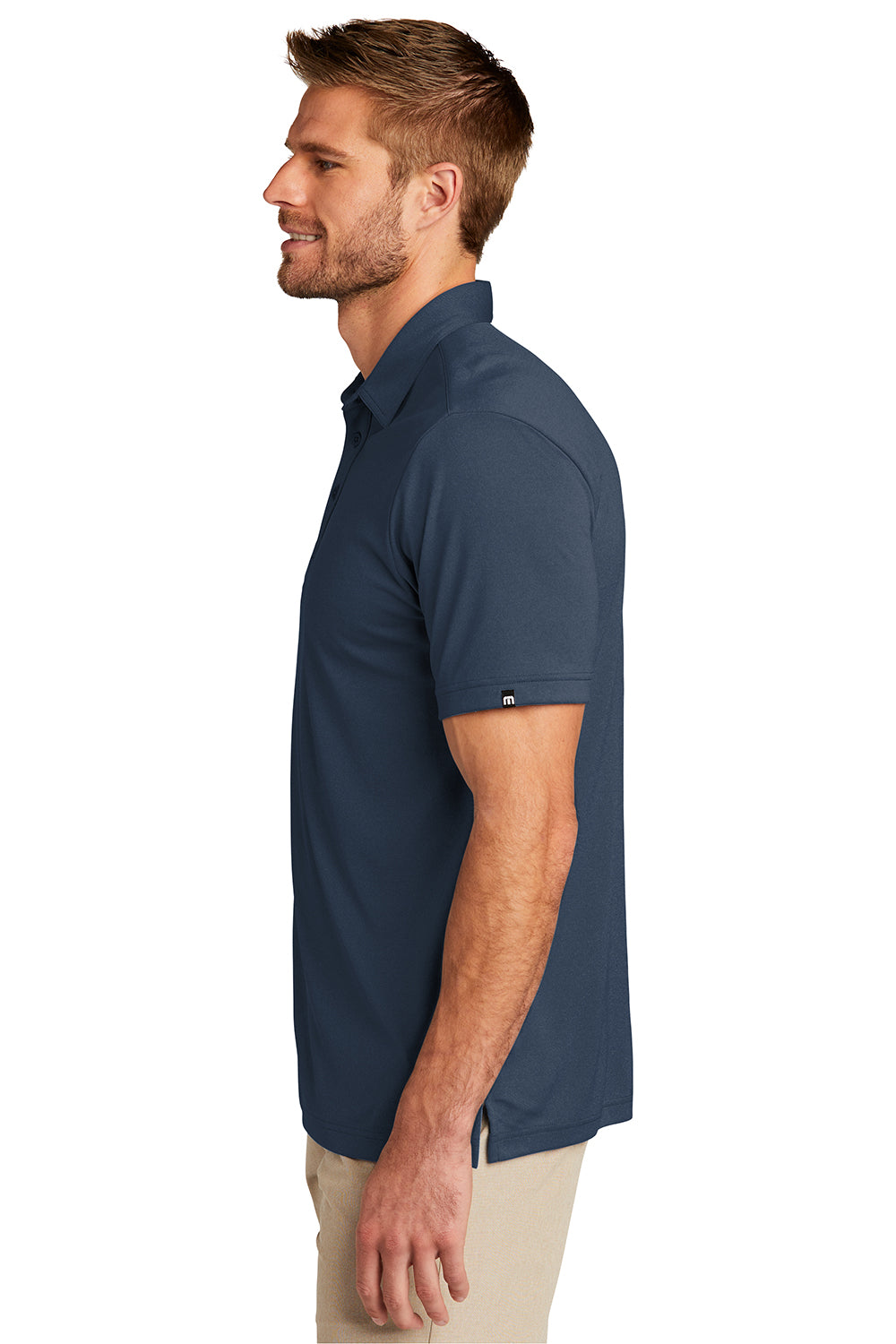 TravisMathew TM1MU410 Mens Coto Performance Moisture Wicking Short Sleeve Polo Shirt Blue Nights Model Side