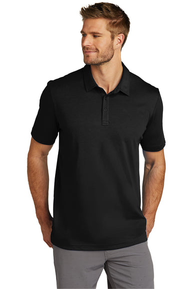 TravisMathew TM1MU411 Mens Oceanside Moisture Wicking Short Sleeve Polo Shirt Black Model Front
