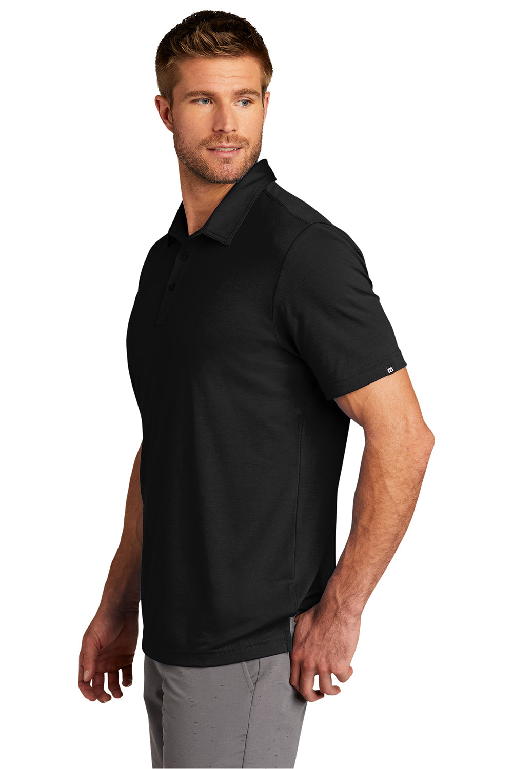 TravisMathew TM1MU411 Mens Oceanside Moisture Wicking Short Sleeve Polo Shirt Black Model Side