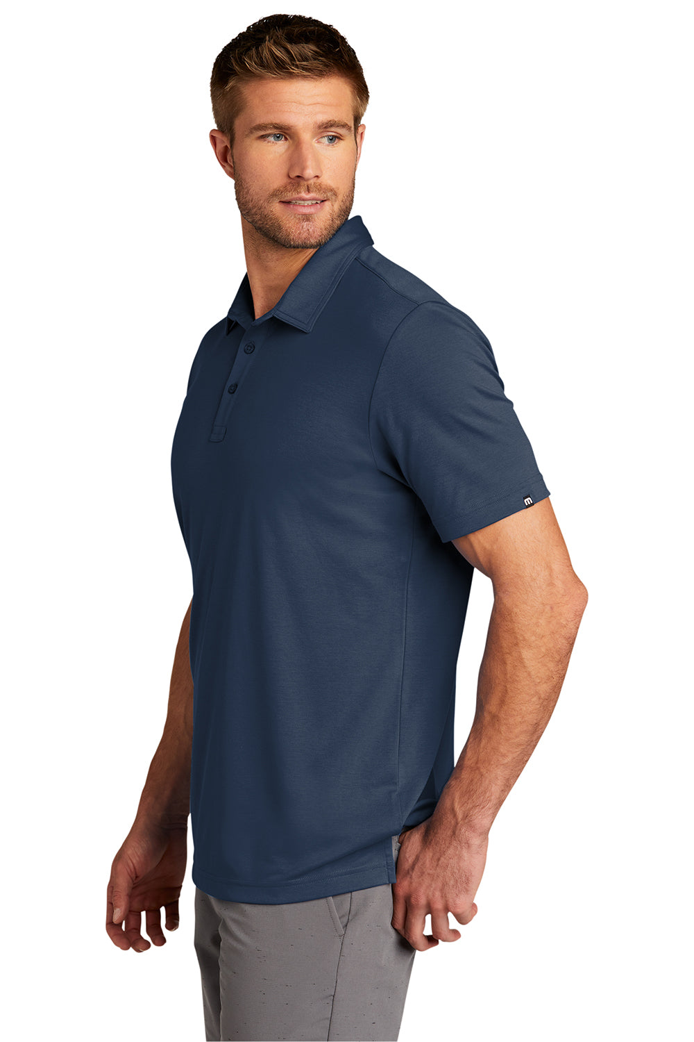 TravisMathew TM1MU411 Mens Oceanside Moisture Wicking Short Sleeve Polo Shirt Blue Nights Model Side