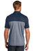 TravisMathew TM1MU414 Mens Oceanside Blocked Moisture Wicking Short Sleeve Polo Shirt Blue Nights/Heather Blue Nights Model Back