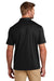 TravisMathew TM1MY400 Mens Coto Performance Wrinkle Resistant Short Sleeve Polo Shirt Black Model Back