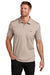 TravisMathew TM1MZ344 Mens Sunsetters Moisture Wicking Short Sleeve Polo Shirt w/ Pocket Heather Portabella Model Front