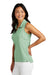 TravisMathew TM1WX001 Womens Coto Performance Wrinkle Resistant Sleeveless Polo Shirt Heather Beryl Green Model Side