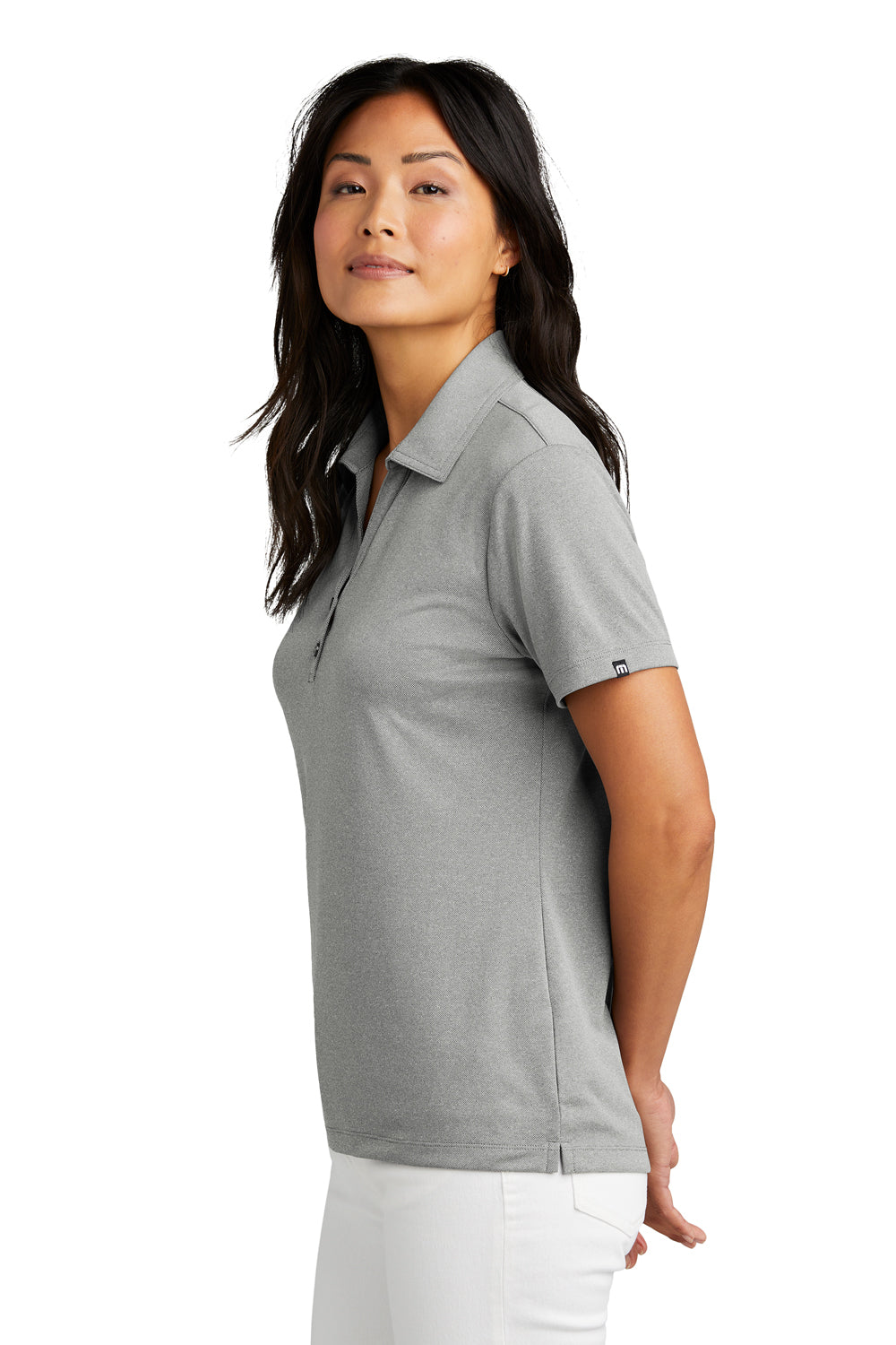 TravisMathew TM1WX002 Womens Coto Performance Wrinkle Resistant Short Sleeve Polo Shirt Heather Quiet Shade Grey Model Side